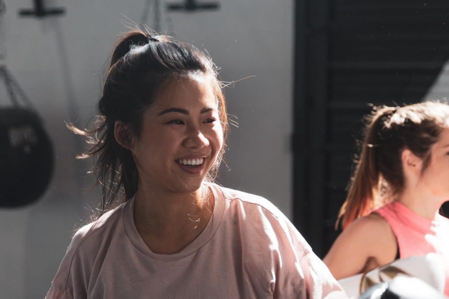 Student smiling in Pilates class
