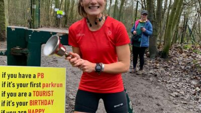 A woman wearing running shorts and t-shirt after running